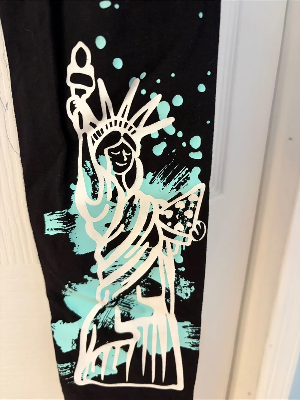 Justice Black Leggings with White NEW YORK Lettering and Teal Graphic